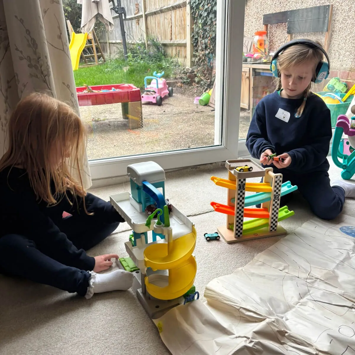 Two kids playing on floor
