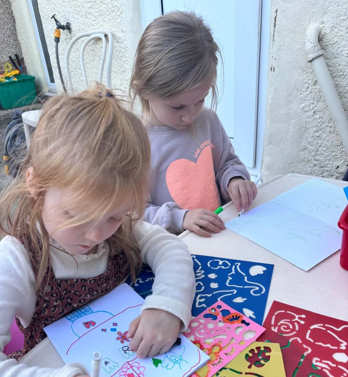 Child painting outdoors